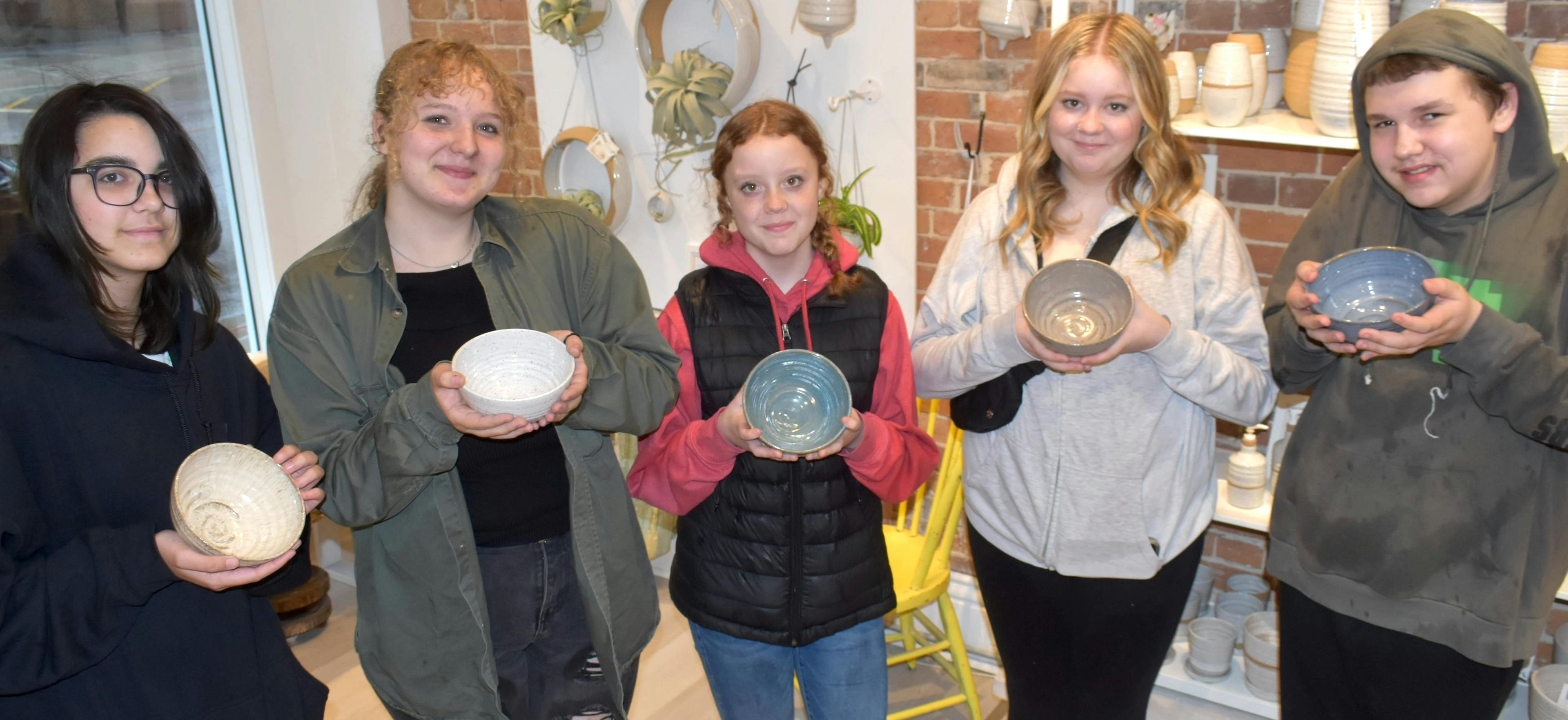 <p>Students from theROC (From left) Jaiden Bennett, Abigail Young, Maggy Solenthaler, Josey Solenthaler, and Walker McCumber show off some of the bowls that will be available for Empty Bowls, a fundraising effort that features soup, bread and deserts from local restaurants and pottery crafted at Ye11ow Studio. (Jason Parks/Gazette Staff)(Jason Parks/Gazette Staff)</p>
