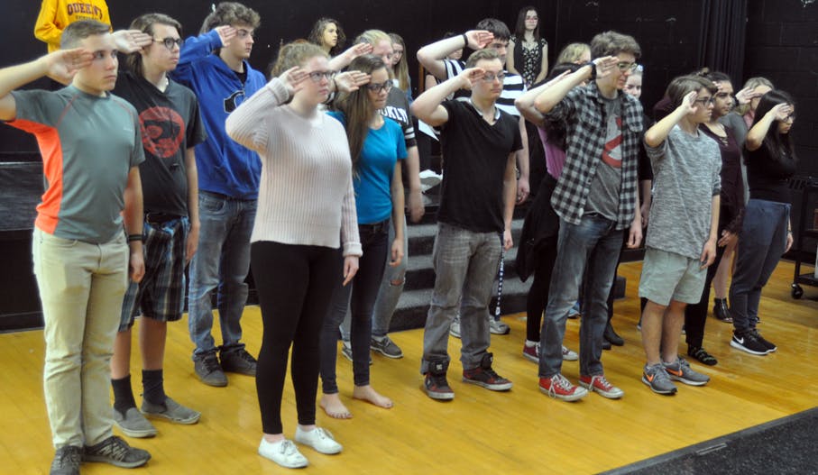 <p>A salute to local history &#8211; PECI drama students practice their salute during a scene in Vimy and the child soldier from Hillier where the township’s fallen veterans are remembered. The student are working on staging the play for community and in-school performances for Remembrance Day. (Adam Bramburger/Gazette staff)</p>
