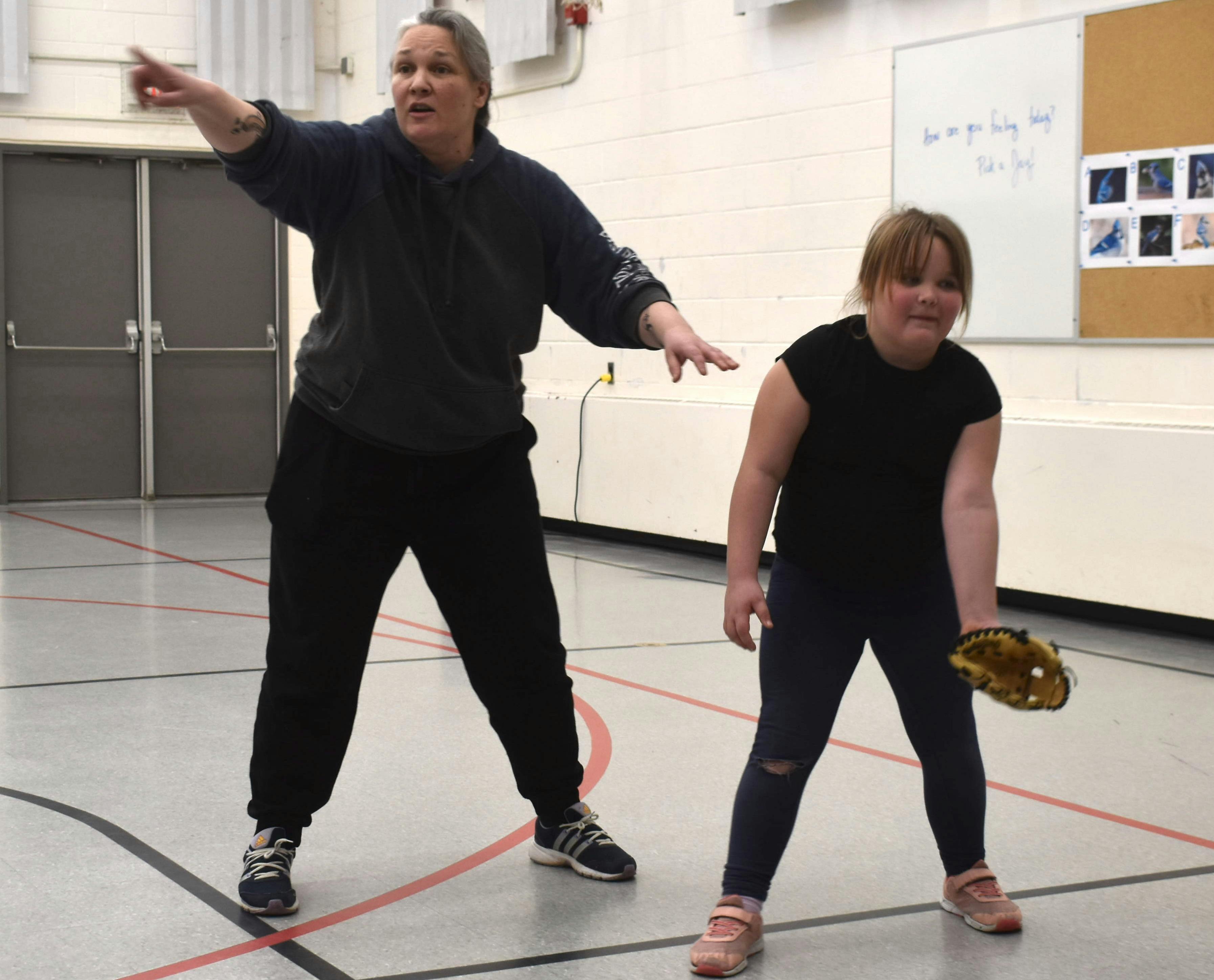 <p>Alison Kelly provides instruction while Jamie Roloson gets ready to field a ground ball at Athol South Marysburgh school. (Jason Parks/Gazette Staff)</p>
